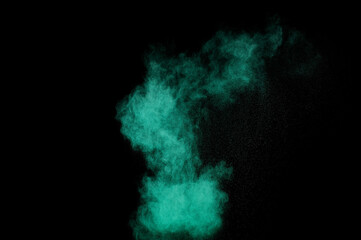 Aquamarine powder explosion on black background. Colored powder cloud. Colorful dust explode. Paint  Holi.