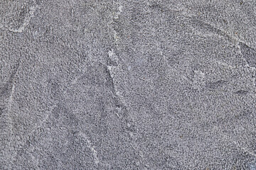 Gray concrete background with white splashes, texture