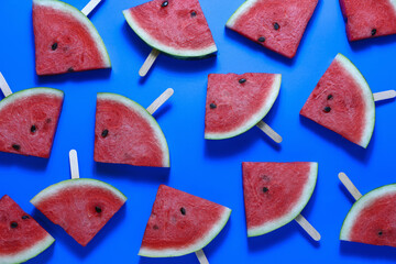 Top view, sliced watermelon fruit on the old blue wooden table for background.