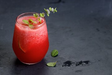Watermelon drink on dark background