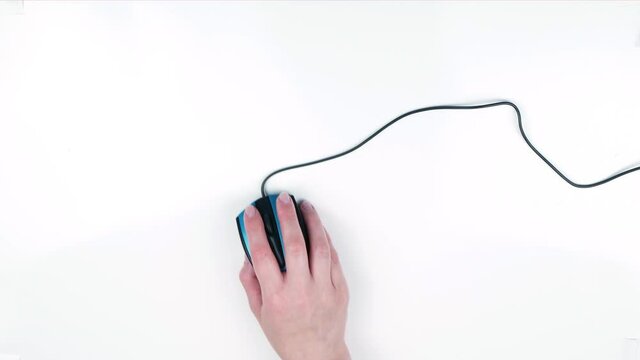 Top view of hand with computer mouse.