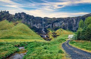 Fototapeta na wymiar Fresh green scene of Foss a Sidu Waterfall. Wonderful morning view of Iceland, Europe. Picturesque landscape of countryside. Traveling concept background..