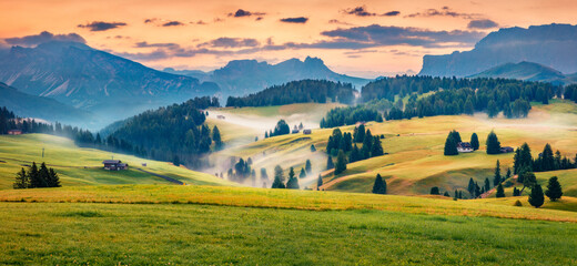 Fototapeta na wymiar Panoramic morning scene of Compaccio village, Seiser Alm or Alpe di Siusi location, Bolzano province, South Tyrol, Italy, Europe. Fabulous summer sunrise of Dolomiti Alps.