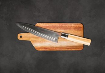 Traditional Japanese gyuto chief knife on a cutting board