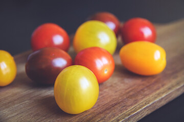 Cocktail tomatoes on a cutting board