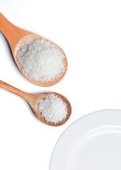 Polished white rice in wooden spoon.