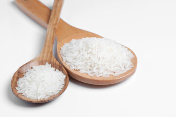 Fototapeta na wymiar Polished white rice in wooden spoon.