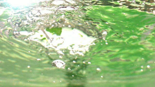 Cherry Tomatoes Falling in Water with Bubbles in Slow Motion
Underwater Shot 4K