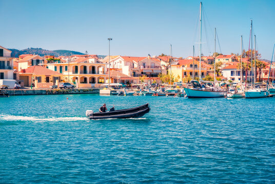 Bright morning view of Lixouri port. Amazing summer seascape of Ionian Sea. Romantic outdoor scene of Kefalonia island. Traveling concept background.