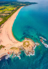 Top down view from flying drone of Torre di Bari tower. Astonishing morning scene of Sardinia island, Italy, Europe. Incredible seascape of Mediterranean sea. Beauty of nature concept background..