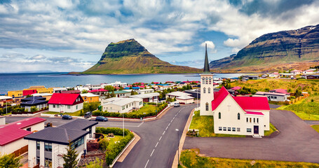 View from flying drone. Splendid morning cityscape of Grundarfjordur town with Kirkjufell Mountain...