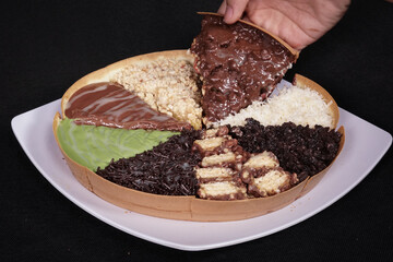 Terang Bulan or sweet martabak is a street food in Indonesia with the basic ingredients of flour and sugar. full color snacks isolated black background