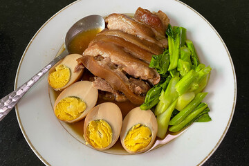 Close up of Pork Stew with egg Thai food called 