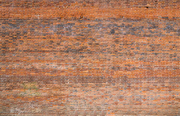 Red brick wall texture grunge background with vignetted corners, may use to interior and exterior design.