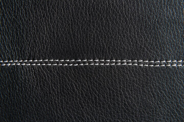 Black leather with white seam close up