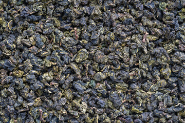Green tea leaves background. Oolong tea. Abstract food textures. Close up .The high end tea of China.
