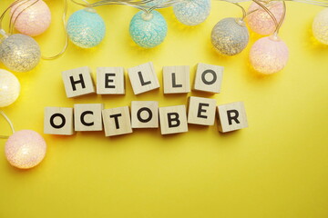 Fototapeta premium Hello October alphabet letter with LED Cotton ball Decoration on yellow background