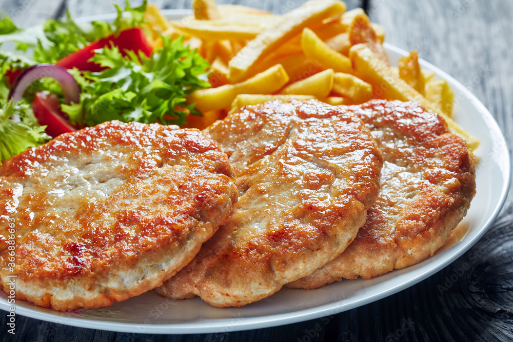 Sticker close-up of fried turkey burgers on a plate