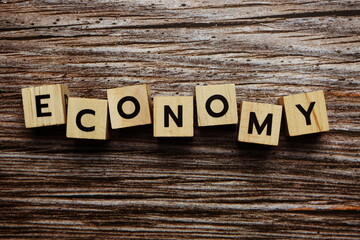 Economy alphabet letter on wooden background