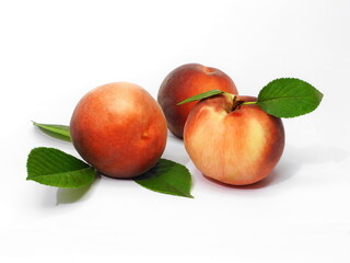 Ripe peaches on white isolated background