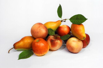 Ripe pears, apples and peaches on white isolated background