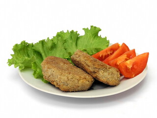 Meat cutlet with vegetables on a plate. Isolate on white.