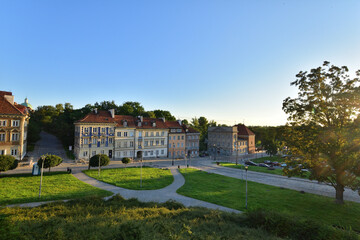 Historic tenement houses in the Warsaw Old Town in the light of the rising sun.