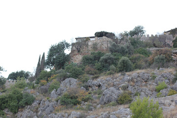 Alanya, TURKEY - August 10, 2013: Travel to Turkey. Clear blue sky. Alanya city. An ancient fortress. Destroyed brick walls.