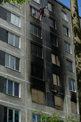 consequences of a fire in a residential building. Soot on the facade of the building