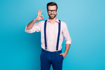 Photo of handsome macho business man good mood trend clothes guy toothy smile showing okey symbol...