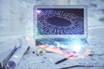Double exposure of desktop computer and technology theme hologram. Concept of software development.