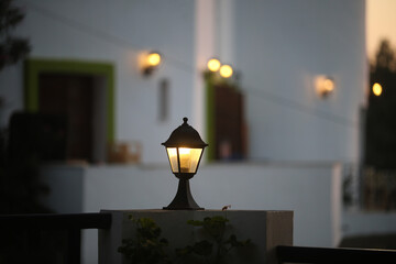 An ancient street lamp on the street at sunset. Greece, Kos Island.