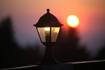 An ancient street lamp on the street at sunset. Greece, Kos Island.