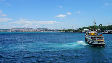 Golden Horn against mosques, Istanbul, Turkey. Panorama of Istanbul waterfront in summer. Beautiful view of an old part of Istanbul city. Vacation and traveling in Istanbul.