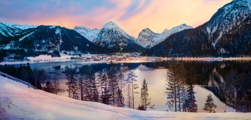 dreamy sunset mood at lake Achensee, view to pertisau tourist resort and snowy alps - obrazy, fototapety, plakaty