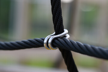 Ropes bound together with metal attachments on a playground