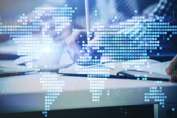 Double exposure of Man writing in notepad with business icons on background.