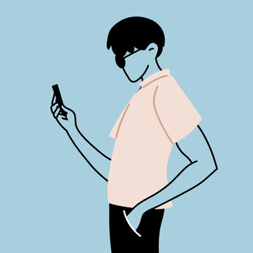 a young man takes a selfie and holds his smartphone in his hand