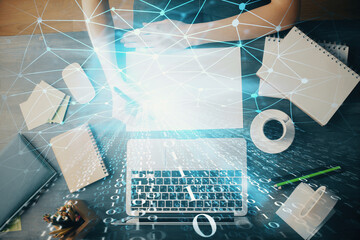 Multi exposure of writing hands on background with data solution hologram. Technology concept.