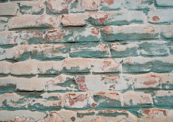 Blue plaster brick wall texture. Old retro building background copy space. Orange stones...