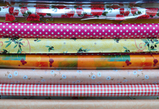 Close Up of Colourful Rolls of Printed Plastic 