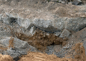 Construction road dig hole dugout stones