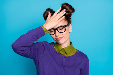 Photo of pretty stressed student lady two buns eyes closed arm on forehead can't remember historic date classroom wear specs shirt collar violet sweater isolated blue color background