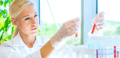 Scientist and students working in lab. Doctor teaching interns to make blood analyzing research. Coronavirus, chemistry, bacteriology, virology and health care