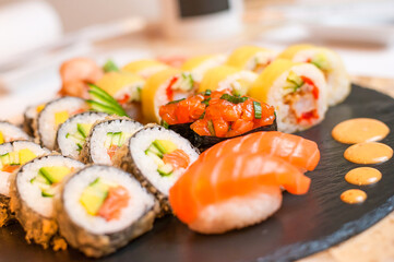 Colorful sushi set placed on the plate with detailed view