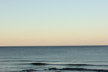 Alanya, TURKEY - August 10, 2013: Travel to Turkey. Sunset at the sea. Clean water surface. Small waves.