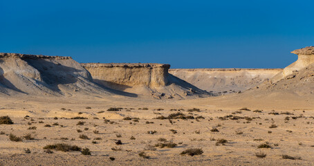 The landscape of the desert in the middle east, formerly being the bottom of the ocean now an arid area with natural resources below or a beautiful place to go on a desert safari 