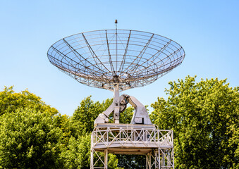 The 10-meter across radio telescope in the parc de la Villette in Paris, France, against blue sky.