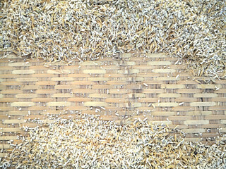 Paddy rice in threshing weaved basket