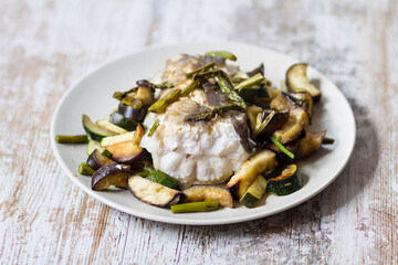 A portion of roasted conger eel with vegetables